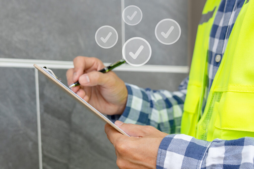 A worker marks checks on a clipboard. Northland Building Supplies is here to make sure that you have the best materials to build your projects.